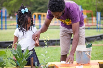 A student learns from a Farm to School instructor